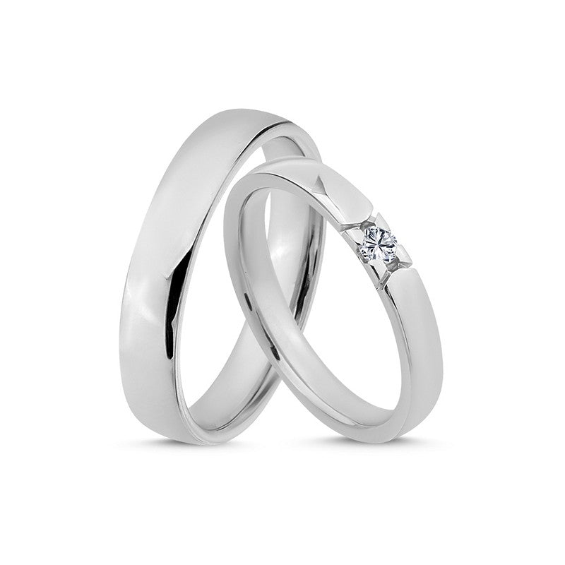 Særlige Nuran vielsesringe i 14 karat hvidguld med 0,07 ct diamant – polerede ringe med klassisk design.